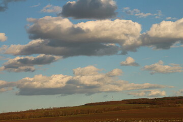 A landscape with clouds and blue sky