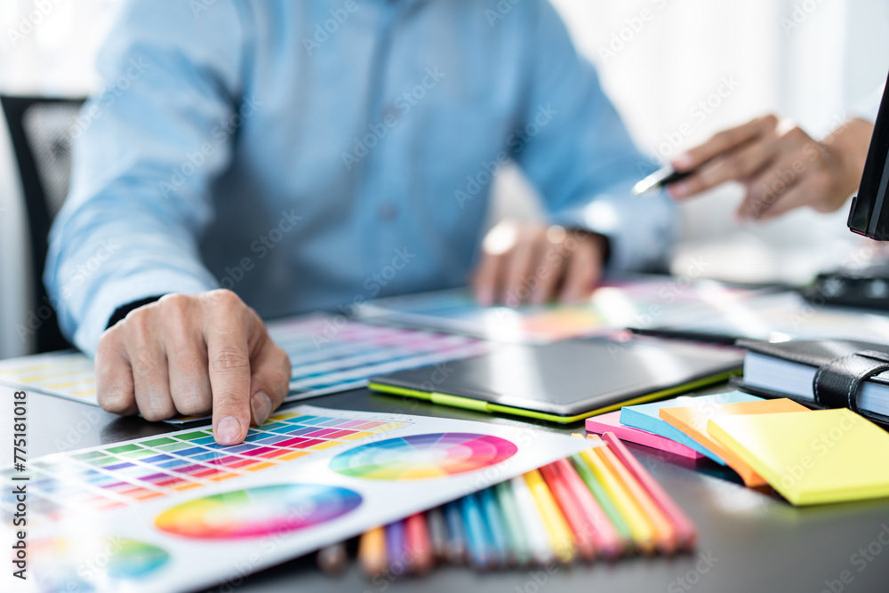 Aufkleber Team of creative graphic designer working on color swatch samples chart for selection coloring in inspiration to create new collection at workplace