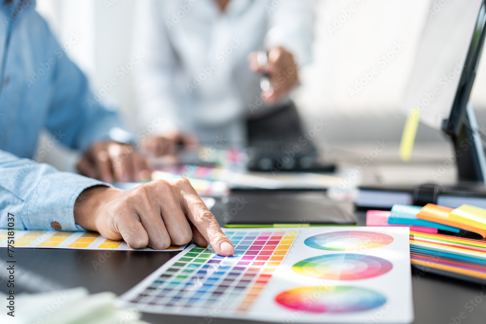 Poster two creative graphic designer team working on color selection and drawing on graphic tablet, color s