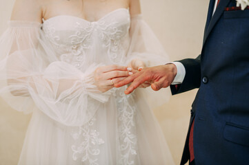 The image depicts a man and woman holding hands at a wedding ceremony 6710.