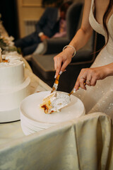 The image shows a woman cutting a piece of cake 6803.
