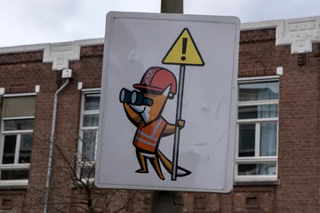 Fototapeten Funny Warning Sign Work On The Road At Amsterdam The Netherlands 29-3-2024 © Robertvt