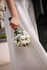 The photo is of a person holding a bouquet of flowers 6869.
