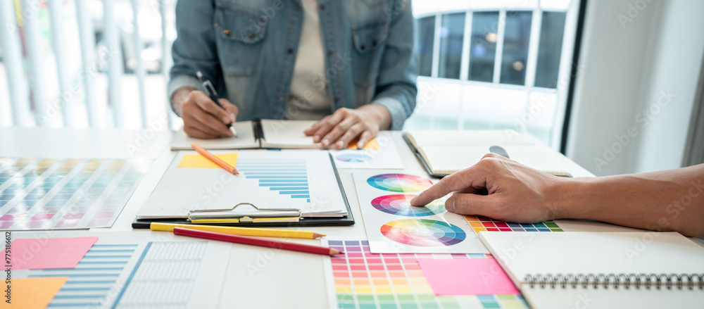 Poster two creative graphic designer team working on color selection and drawing on graphic tablet, color s
