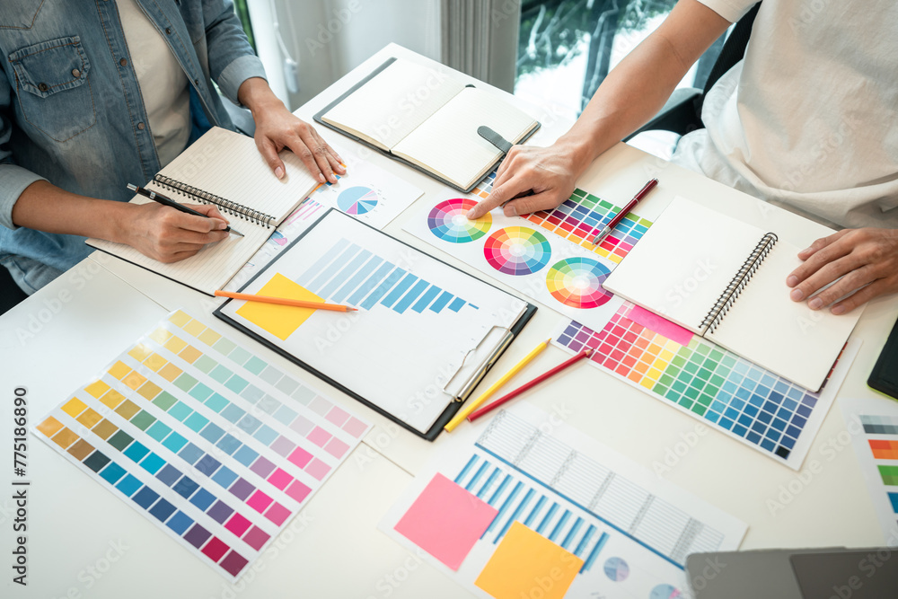 Poster two creative graphic designer team working on color selection and drawing on graphic tablet, color s