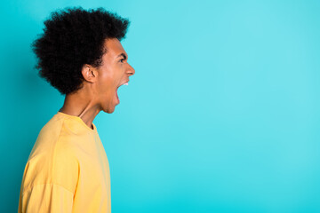 Side profile photo of angry man with afro hairstyle wear oversize t-shirt loud scream look empty...