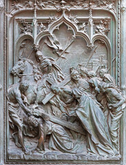 MILAN, ITALY - SEPTEMBER 16, 2024: The detail from main bronze gate of the Cathedral - Fall of Jesus under the Cross -  by Ludovico Pogliaghi (1906). - 775188056