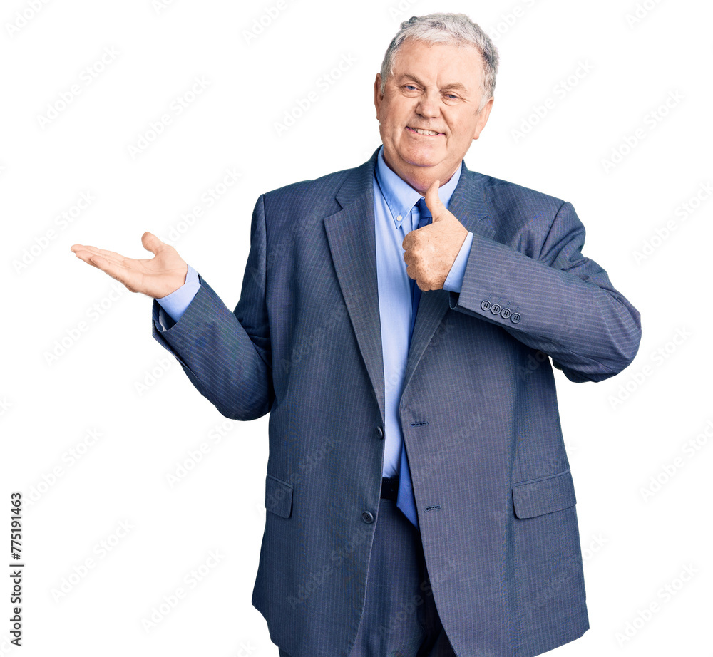 Wall mural Senior grey-haired man wearing business jacket showing palm hand and doing ok gesture with thumbs up, smiling happy and cheerful