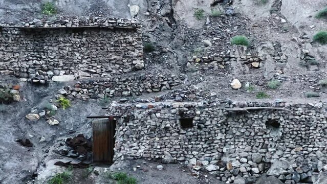 Old villages in Tajikistan. Tajikistan's road along the Zeravshan River near the Pamir highway. Old stone villages in the mountains of the Silk Road. 4К
