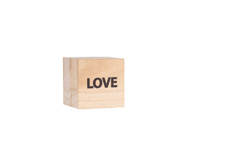 wooden cubes with the inscription Love on a white isolated background close-up