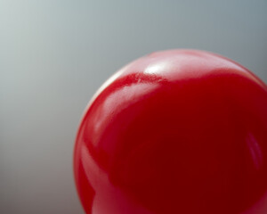 Red ball on a gray background. - 775199453