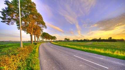 A bend in the road. Country-side Holland at sunset.