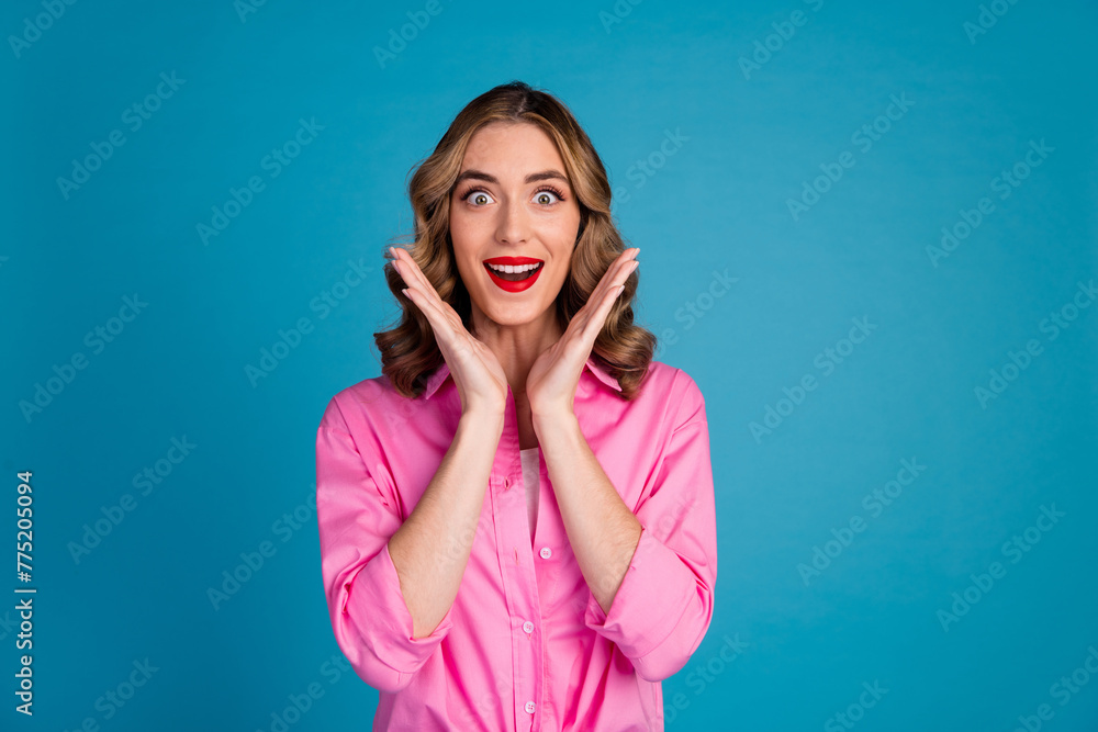 Sticker Photo portrait of lovely young lady raise hands amazed reaction dressed stylish pink garment hairdo isolated on blue color background