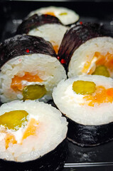 Overhead japanese sushi food. Maki ands rolls with tuna, salmon, shrimp, crab and avocado. Rainbow sushi roll, uramaki, hosomaki and nigiri.