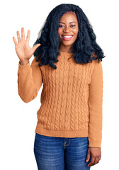Beautiful african american woman wearing casual  sweater showing and pointing up with fingers number five while smiling confident and happy.