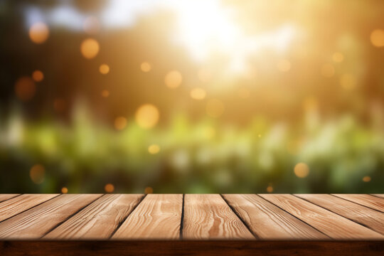 Empty wooden planks or tabletop in front of a blurred bokeh lush grass nature environment with water drops and minimalist background a product display background or wallpaper concept with backlighting