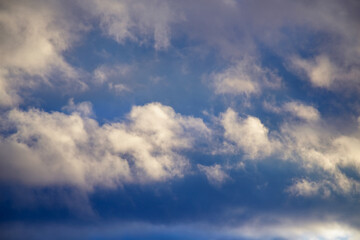 Naklejka na ściany i meble Torn rare clouds in the sky close-up