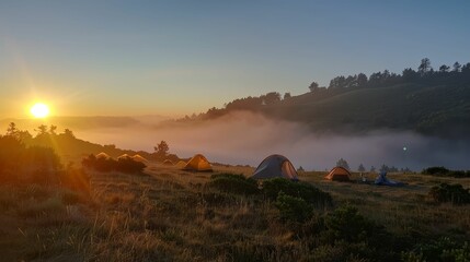 Sunrise over a misty campsite, tents aglow, days promise - obrazy, fototapety, plakaty