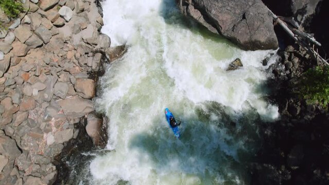 Epic Drone Shot of Whitewater Kayaking Over a Waterfall