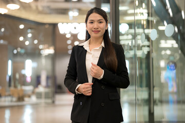 Confident businesswoman in modern office environment - 775232074