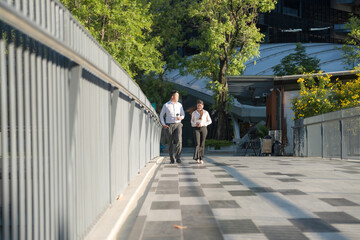 Business colleagues walking in urban setting