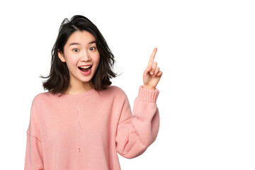 young Asian woman with a wide smile raises her hand upwards indicating that she has a brilliant idea, isolated on a transparent background