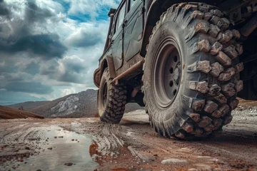 Fotobehang Powerful Off-Road Truck Tires for Extreme Terrain   Heavy Duty Vehicle with Alloy Wheels and Superior Suspension © Serhii