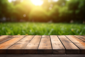 Empty wooden planks or tabletop in front of a blurred bokeh lush grass nature environment and modern background a product display background or wallpaper concept with front-lighting 
