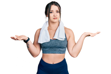Young hispanic girl wearing sportswear and towel clueless and confused with open arms, no idea concept.