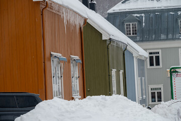 Colorful Houses with Icicles in Rjukan's Winter Street
