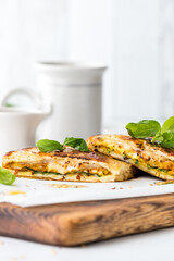 Naan bread breakfast sandwiches with basil and honey. 