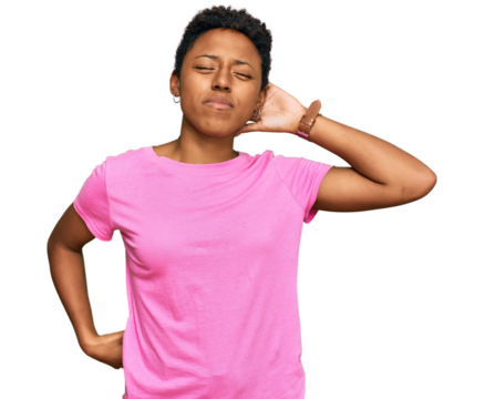 Young african american woman wearing casual clothes suffering of neck ache injury, touching neck with hand, muscular pain
