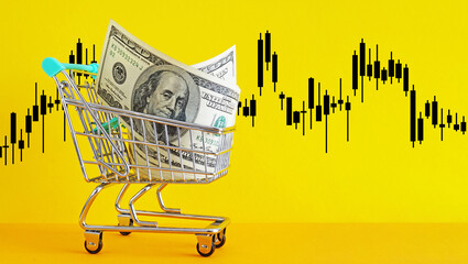 Trolley with dollars and stock market chart graph for currency exchange and global trade forex...