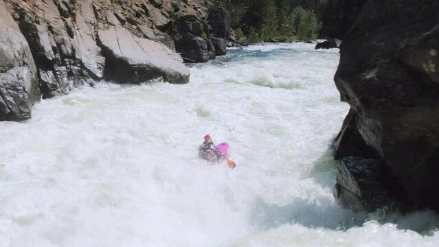 Man Paddling Whitewater Kayak Over Waterfall Shot by Drone