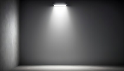 A single bright light shining on a grey wall.