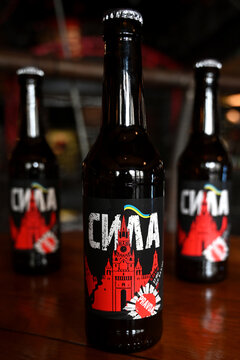 Lviv, Ukraine - April 2, 2024: A botles of localy brewed beer called Power with label depicting a destroyed Moscow Kremlin with flag of Ukraine.
