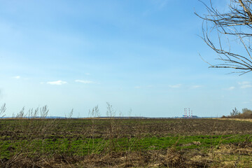 View of a large operating power plant with tall chimneys, panoramic view