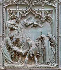 MILAN, ITALY - SEPTEMBER 16, 2024: The detail from main bronze gate of the Cathedral -   Burial of Jesus in the temple -  by Ludovico Pogliaghi (1906). - 775309834