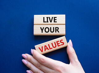 Live your values symbol. Concept words Live your values on wooden blocks. Beautiful deep blue...