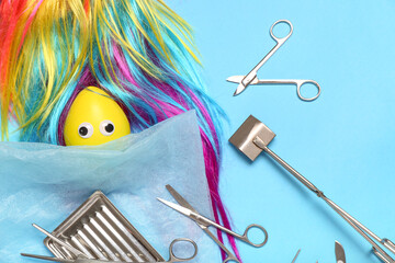 Composition with surgeon's tools and party decor for April Fools Day on color background