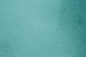 green paper surface with grainy texture