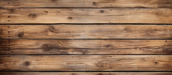 Detailed view of a rustic wooden wall featuring an abundance of individual planks and natural...