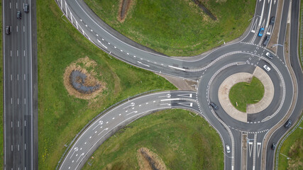 Dutch roundabout on road N459 from A12 at Reeuwijk near Gouda in Netherlands. Traffic flows at efficient pace with cars in highway lanes entering and exiting motorway. drone aerial view of transport
- 775336447
