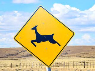 deer jumping  sign in Patagonia at the street