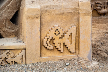  adobe walls and decorations in the archaeological site of Chan Chan made by the Chimu civilization near Trujillo, Peru