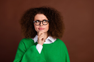 Portrait of clever minded pretty lady arm touch chin look interested empty space ponder isolated on...