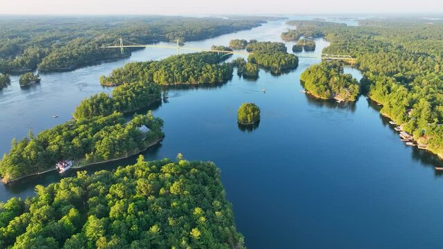Aerial video of St. Lawrence river in 1000 Islands near US boarder and Hill Island looking at the 1000 Islands Bridge.