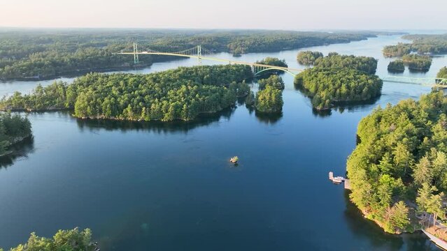 Aerial video of St. Lawrence river in 1000 Islands near US boarder and Hill Island looking at the 1000 Islands Bridge.