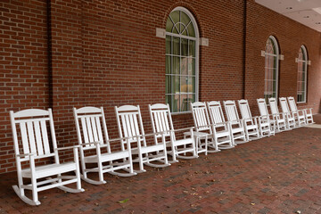 White rocking chairs in a row in downtown Staunton, Virginia,  USA