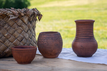 Clay jugs and a pot. A set of ancient utensils.